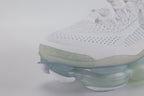 Air Max Scorpion Flyknit White Football Grey Ice Blue - Toe Box Top Down View on Grey Background Showing White Fine-Knit Flyknit with Grey Speckle Dots White Tonal Mini Swoosh White Flat Laces White Rectangular Lace Keeper with Grey Dot-Grid Texture and White Iridescent Flyknit on Lateral Midfoot