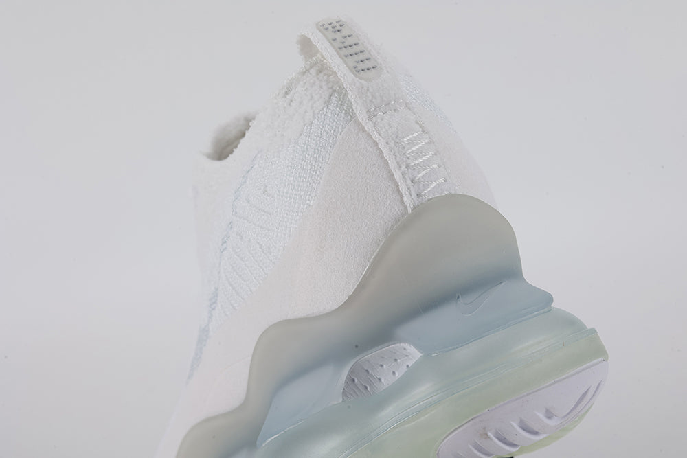 Air Max Scorpion Flyknit White Football Grey Ice Blue - Lace Area and Collar Close Up on Grey Background Showing White Terry Loop-Pile Flyknit with Silver Metallic Thread White Iridescent Flyknit on Lateral Midfoot White Tonal Sketch-Outline Swoosh White Flat Laces and Frosted Ice AM Scorpion Air Unit