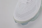 Air Max Scorpion Flyknit White Football Grey Ice Blue - Rear View of Both Shoes on Grey Background Showing White Wide Rubber Heel Pull Tabs with Grey Dot-Grid Texture White Collar Lining White Woven Care Label at Collar Interior Football Grey Midsole Heel Counter and Frosted Ice AM Scorpion Air Unit with Ice Blue Chambers at Heel