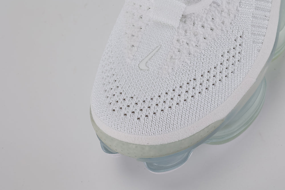 Air Max Scorpion Flyknit White Football Grey Ice Blue - Rear View of Both Shoes on Grey Background Showing White Wide Rubber Heel Pull Tabs with Grey Dot-Grid Texture White Collar Lining White Woven Care Label at Collar Interior Football Grey Midsole Heel Counter and Frosted Ice AM Scorpion Air Unit with Ice Blue Chambers at Heel