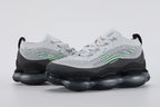 Air Max Scorpion Flyknit Wolf Grey Volt Racer Blue Black - Full Outsole View on Grey Background Showing Full-Coverage Black AM Scorpion Air Base Dark Grey Central Air Chamber Bases and Black Rubber Chevron Traction