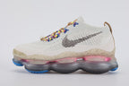 Air Max Scorpion Hiking - Toe Box Close Up on White Background Showing Sail Coarse Boucle Loop-Pile Flyknit Toe Box Blue Star-Form Lace Locks Multicolour Volt Yellow Pink Blue Purple Paracord Lace and Sail Speckle-Print Midsole Sidewall with Blue Air Chamber Pods at Forefoot Corners