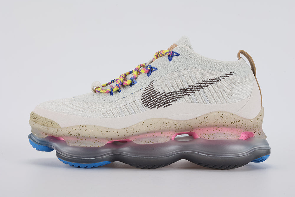 Air Max Scorpion Hiking - Toe Box Close Up on White Background Showing Sail Coarse Boucle Loop-Pile Flyknit Toe Box Blue Star-Form Lace Locks Multicolour Volt Yellow Pink Blue Purple Paracord Lace and Sail Speckle-Print Midsole Sidewall with Blue Air Chamber Pods at Forefoot Corners