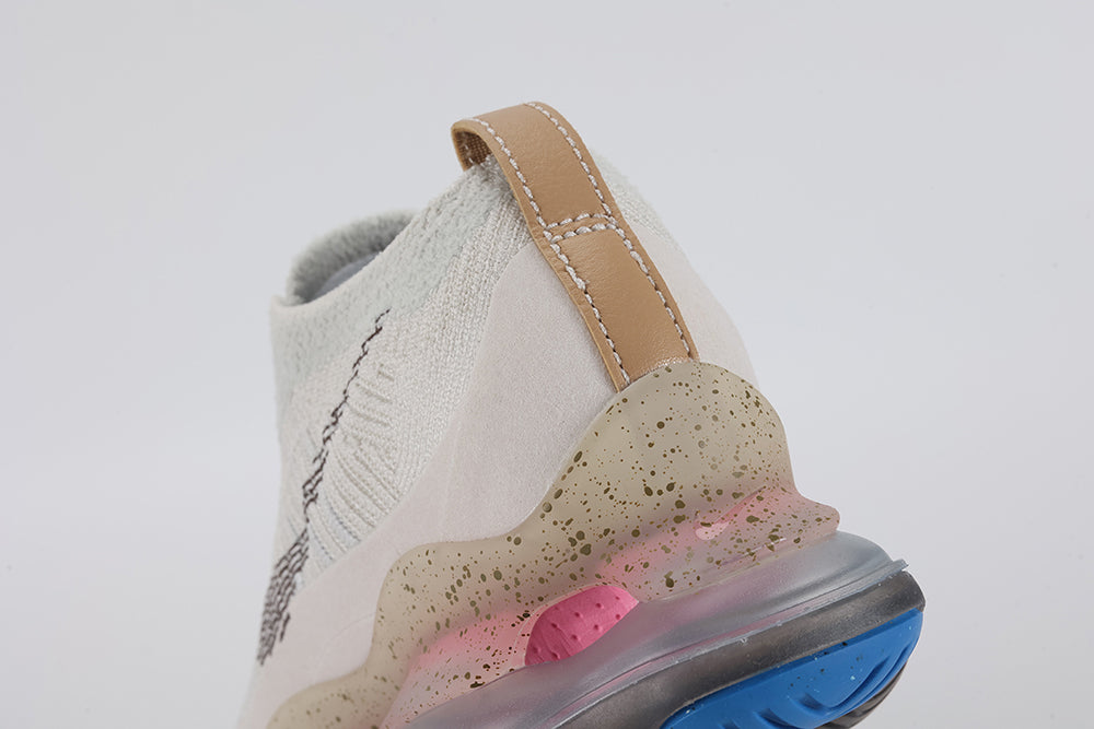 Air Max Scorpion Hiking - Lace Close Up on White Background Showing Blue Star-Form Plastic Lace Locks at Each Eyelet Multicolour Volt Yellow Pink Blue Purple Paracord Braid Lace Sail Boucle Loop-Pile Flyknit Upper and Tan Leather Tongue Badge