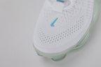 Air Max Scorpion Lagoon Pulse - Rear View of Both Shoes on White Background Showing Hot Punch Coral-Red Wide Rubber Heel Pull Tabs with Teal Dot-Grid Texture on Both Sides White Flyknit Ankle Collar and Full-Length Mint Ice Green Tinted AM Scorpion Multi-Chamber Air Unit