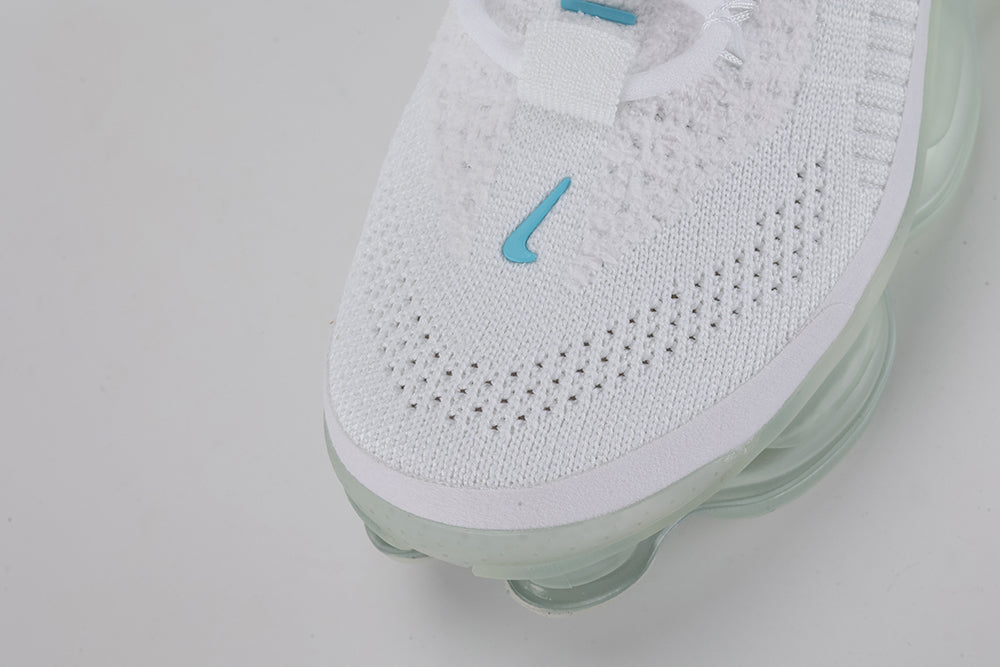 Air Max Scorpion Lagoon Pulse - Rear View of Both Shoes on White Background Showing Hot Punch Coral-Red Wide Rubber Heel Pull Tabs with Teal Dot-Grid Texture on Both Sides White Flyknit Ankle Collar and Full-Length Mint Ice Green Tinted AM Scorpion Multi-Chamber Air Unit