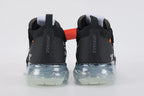 Air VaporMax co-branded Part 2 Black White Orange - Full Outsole View on White Background Showing Frosted Ice Semi-Transparent VaporMax Cylindrical Air Chamber Array Glow-in-Dark Phosphorescent Green Forefoot Air Chamber Bases White Mini Swoosh on Forefoot Air Base and Dark Grey Inner Base Plate with Horizontal Texture