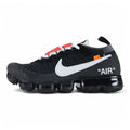 Air VaporMax co-branded The Ten Black White Red - Full Lateral Profile View on White Background Showing Black Fine-Knit Flyknit Upper White Large Swoosh with Black Edge Stitching Red Industrial Zip Tie White Flat Laces White Woven Tongue Label with Orange Swoosh White AIR Quotation-Mark Text at Heel Midsole Junction and Full Black VaporMax Cylindrical Air Chamber Array