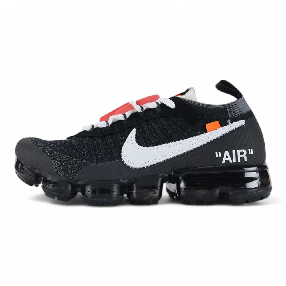 Air VaporMax co-branded The Ten Black White Red - Full Lateral Profile View on White Background Showing Black Fine-Knit Flyknit Upper White Large Swoosh with Black Edge Stitching Red Industrial Zip Tie White Flat Laces White Woven Tongue Label with Orange Swoosh White AIR Quotation-Mark Text at Heel Midsole Junction and Full Black VaporMax Cylindrical Air Chamber Array